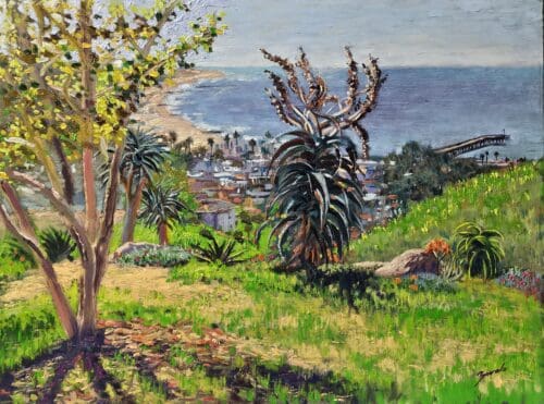 A Ruben Zavala painting of a coastal landscape with trees and plants in the foreground and a seaside town with a pier in the distance. The ocean and sky extend to the horizon, capturing the serene beauty of nature.