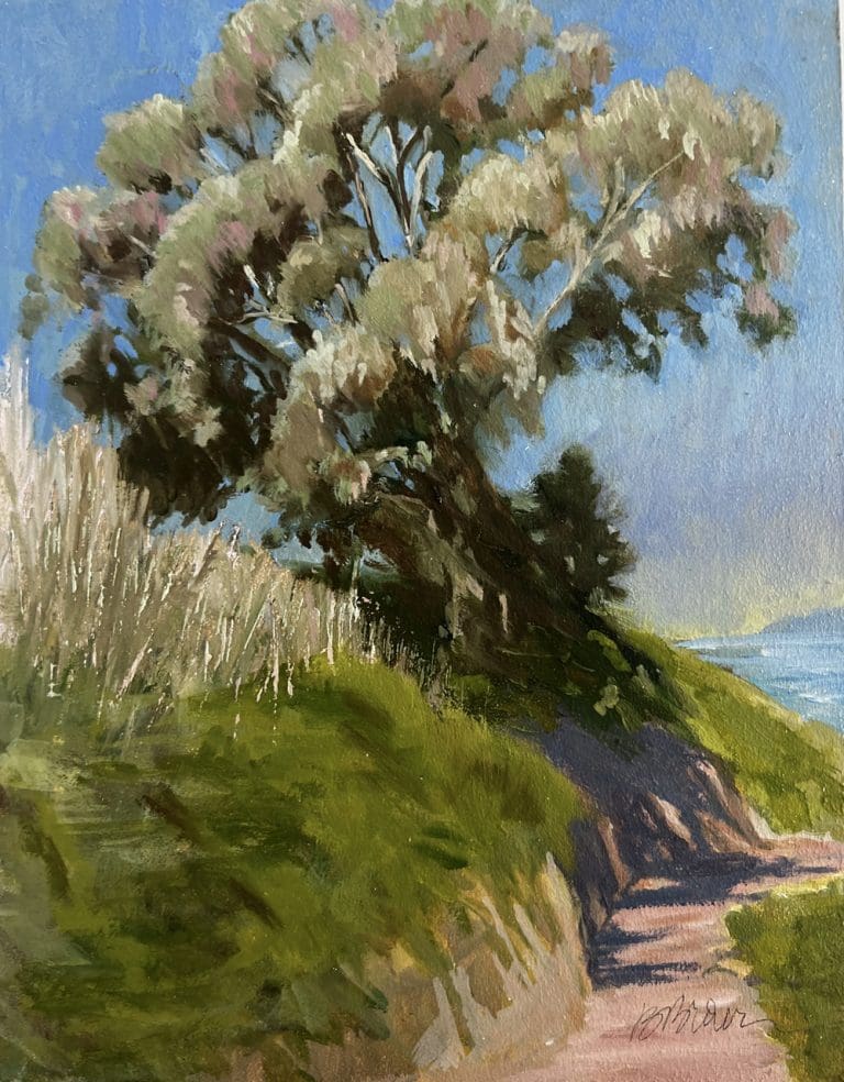 A windswept tree stands on a grassy hill under a clear blue sky, with a dirt path leading through the landscape.